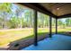 Covered patio with sleek columns and a great view of the wooded backyard at 90 Ayers Rd, Bowdon, GA 30108