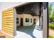 Covered patio features a ceiling fan, recessed lighting, and wooded views at 90 Ayers Rd, Bowdon, GA 30108