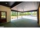 Cozy patio space with views of wooded surroundings, ceiling fan, and recessed lights at 90 Ayers Rd, Bowdon, GA 30108