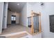 Carpeted stairs feature wooden railing with decorative black iron spindles leading to an open area at 90 Ayers Rd, Bowdon, GA 30108