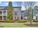 Beautiful brick home with manicured landscaping, mature trees, and inviting front entrance at 147 Hubbard Rd, Woodstock, GA 30188