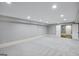 Spacious unfinished basement with gray carpet, offering potential for customization at 147 Hubbard Rd, Woodstock, GA 30188