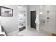 Updated bathroom featuring a tiled shower with glass doors and a glimpse of the bedroom at 147 Hubbard Rd, Woodstock, GA 30188