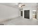 Spacious bedroom with plush carpet, neutral paint, and ensuite bathroom at 147 Hubbard Rd, Woodstock, GA 30188