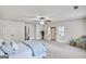 Expansive bedroom with ensuite access, windows, closet, and ceiling fan at 147 Hubbard Rd, Woodstock, GA 30188