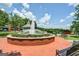 Community park featuring a water fountain and benches surrounded by greenery at 147 Hubbard Rd, Woodstock, GA 30188