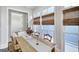 Dining room with windows, and table with chairs, adjacent to an open doorway at 147 Hubbard Rd, Woodstock, GA 30188