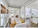Elegant dining room featuring natural light and convenient access to the sunroom and kitchen at 147 Hubbard Rd, Woodstock, GA 30188