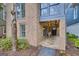 Charming brick exterior with string lights, a stone porch, and beautiful landscaping at 147 Hubbard Rd, Woodstock, GA 30188
