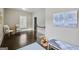 Bright hallway with hardwood floors, natural light, and inviting decor at 147 Hubbard Rd, Woodstock, GA 30188