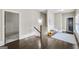 Upstairs hallway with hardwood floors, natural light, and charming decor elements at 147 Hubbard Rd, Woodstock, GA 30188