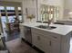 Bright kitchen featuring stainless steel appliances, a large island, and an adjacent dining area at 147 Hubbard Rd, Woodstock, GA 30188
