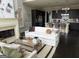 Comfortable living room with fireplace, modern decor, and seamless flow to an open kitchen at 147 Hubbard Rd, Woodstock, GA 30188