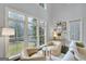 Cozy sitting area featuring ample natural light and comfortable chairs, perfect for relaxing at 147 Hubbard Rd, Woodstock, GA 30188
