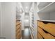 Spacious walk-in closet with custom shelving and drawers for optimal organization and storage at 147 Hubbard Rd, Woodstock, GA 30188
