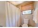 Clean bathroom with a shower/tub combo and a window at 463 Conyers Rd, Mcdonough, GA 30253