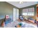 Cozy bedroom with a sitting area and view into the bathroom at 463 Conyers Rd, Mcdonough, GA 30253
