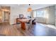 Spacious dining area with hardwood floors and a large wooden table at 463 Conyers Rd, Mcdonough, GA 30253