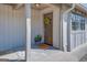 Inviting front door with porch and potted plants at 463 Conyers Rd, Mcdonough, GA 30253