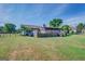 Back of house features large deck and screened porch at 463 Conyers Rd, Mcdonough, GA 30253