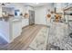 Modern kitchen with stainless steel appliances and wood-look flooring at 463 Conyers Rd, Mcdonough, GA 30253