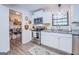 Updated kitchen with stainless steel appliances and white cabinets at 463 Conyers Rd, Mcdonough, GA 30253