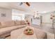 Spacious living area with hardwood floors and a comfortable sectional sofa at 463 Conyers Rd, Mcdonough, GA 30253