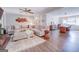 Open and bright living room with hardwood floors and large sectional sofa at 463 Conyers Rd, Mcdonough, GA 30253