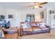 Living area showcasing a leather couch, a home office space, and built-in shelving at 463 Conyers Rd, Mcdonough, GA 30253
