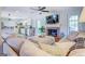 Open living room with a cozy fireplace and comfortable sectional sofa at 463 Conyers Rd, Mcdonough, GA 30253