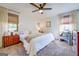 Bright main bedroom with a king-size bed and stylish mid-century furniture at 463 Conyers Rd, Mcdonough, GA 30253
