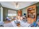 Home office with built-in bookshelves and a comfortable armchair at 463 Conyers Rd, Mcdonough, GA 30253