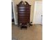 Well-lit bedroom with tall dresser and hardwood floors at 4220 Se Lindsey Way, Conyers, GA 30013