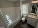 Clean bathroom featuring a tub, toilet, and vanity at 385 Mcgiboney Ln, Covington, GA 30016