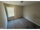Spacious bedroom with carpeted floor and large window at 385 Mcgiboney Ln, Covington, GA 30016