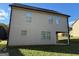 Rear view of house showcasing additional windows and patio at 385 Mcgiboney Ln, Covington, GA 30016