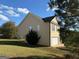 Tan house with a side view of garage and large backyard at 385 Mcgiboney Ln, Covington, GA 30016