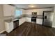 Modern kitchen featuring white cabinets and granite countertops at 385 Mcgiboney Ln, Covington, GA 30016