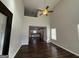 Two-story living room with dark hardwood floors and high ceilings at 385 Mcgiboney Ln, Covington, GA 30016