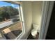 Convenient half bathroom with a toilet and window at 385 Mcgiboney Ln, Covington, GA 30016