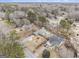 Aerial view showcasing the neighborhood, including a home with a pool, trees, and surroundings at 546 Paden Dr, Lawrenceville, GA 30044