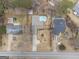Aerial view of a home with an inground pool, surrounded by neighboring houses and greenery at 546 Paden Dr, Lawrenceville, GA 30044