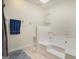 Bathroom with a built-in bathtub, tiled floors, and a blue towel at 546 Paden Dr, Lawrenceville, GA 30044