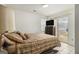 Comfortable bedroom featuring a sliding glass door to the yard, a TV, and neutral decor at 546 Paden Dr, Lawrenceville, GA 30044