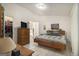 Comfortable bedroom with tiled flooring, ensuite bathroom, and ample natural light at 546 Paden Dr, Lawrenceville, GA 30044