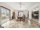 Dining area featuring tile floors, a modern chandelier, and access to the patio and living spaces at 546 Paden Dr, Lawrenceville, GA 30044