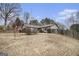 Charming single-story home with a well-manicured front yard, mature trees and an attached garage at 546 Paden Dr, Lawrenceville, GA 30044