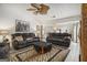 Inviting living room with comfortable seating, a ceiling fan, and access to the dining area at 546 Paden Dr, Lawrenceville, GA 30044