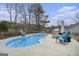 Inviting backyard oasis features a sparkling pool, comfortable lounge chairs, and a grill at 546 Paden Dr, Lawrenceville, GA 30044