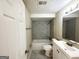 Updated bathroom with a marble-tiled shower/tub combo and modern vanity at 1876 Flat Shoals Se Rd, Atlanta, GA 30316
